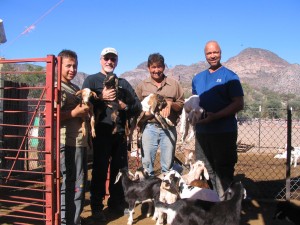 Jay, Rod, Jose Luis and son with  new baby goats at Rancho San  Isidro.